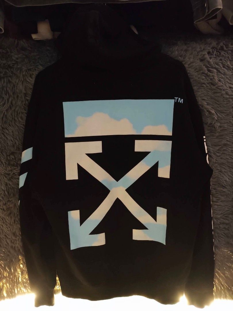 OFF-WHITE "Main Label" Surrealist (Category: Coats, Jackets and Outerwear) located in Quezon City. Submitted by rezno (Listing ID 1462435529, Image 1). Description: - Authentic OFF-WHITE Hoodie - Color: Black - Size: L - XL 23 x 29 - Back Graphic: Iconic cloud design - Front Graphic: Orange bird - Left Sleeve Detail: 'Surrealist' text - Right Sleeve Detail: Diagonal stripes - Origin: Made in Portugal.