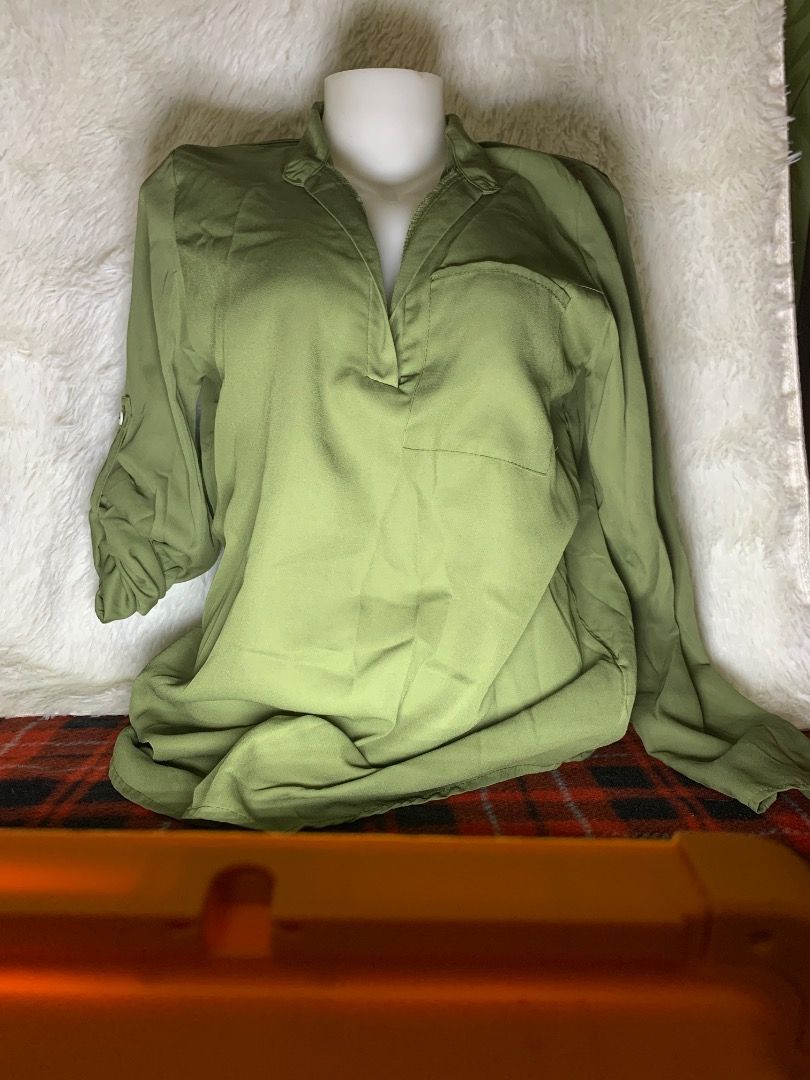 Olive Green Long Sleeve Collared Blouse (Category: Blouses) located in Tanjay. Submitted by madscart (Listing ID 1462399525, Image 1). Description: - Casual olive green blouse - Collared neckline with partial button closure - Long sleeves with roll-up tab - Single chest pocket - Lightweight fabric - Ideal for everyday wear.