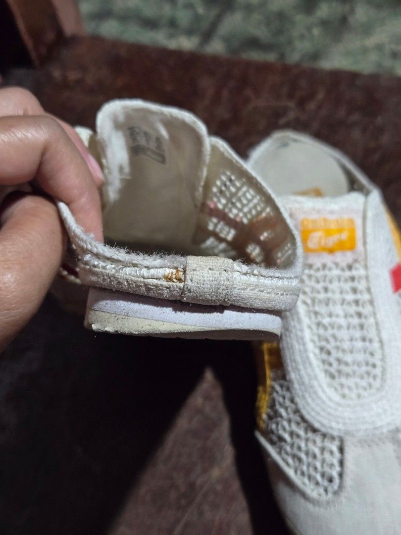 Onitsuka Tiger White Mesh Slip-On Shoes (Category: Sneakers) located in Pasig City. Submitted by princesspow (Listing ID 1462329025, Image 2). Description: - White Onitsuka Tiger slip-on shoes - Breathable mesh upper - Iconic yellow and red stripe accents - Size: 39.5 Euro / 6.5 US - Made in Indonesia - Minor signs of wear on sole and fabric.
