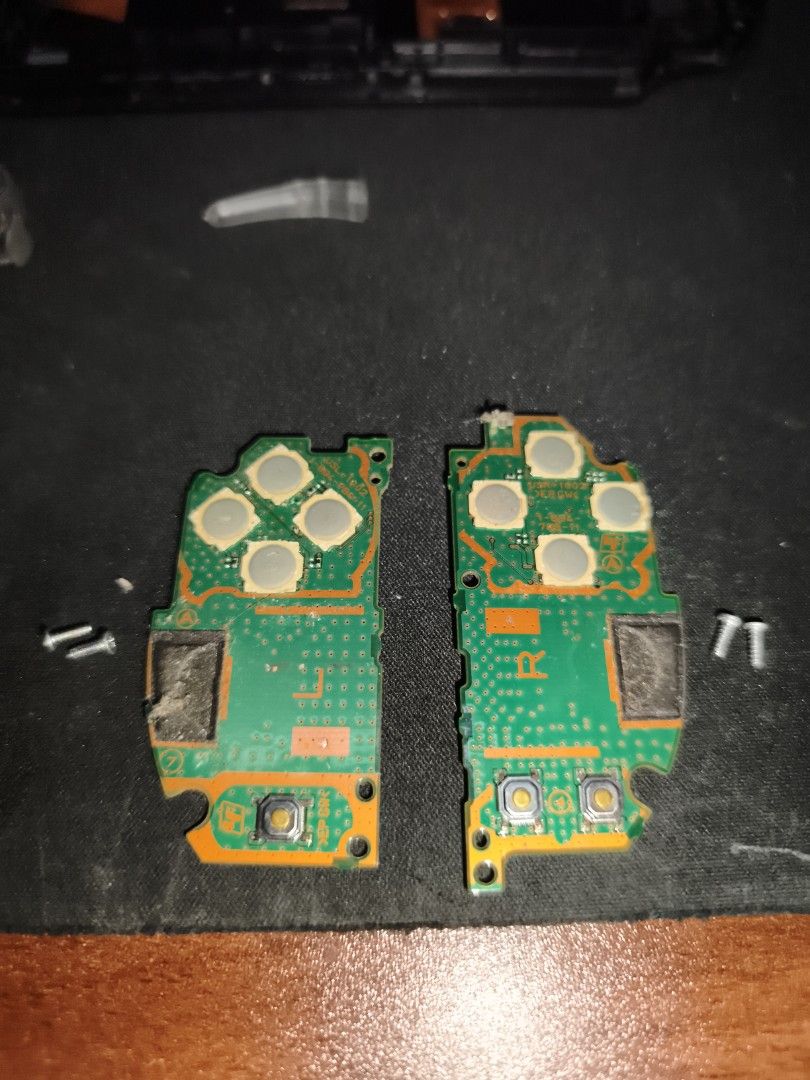 Original PSVita 2000 Controller Circuit Boards (Category: Controllers) located in Davao. Submitted by duriandragonfruit (Listing ID 1462426033, Image 1). Description: - Set of Original PSVita 2000 controller circuit boards, Left and Right - Screws included. - Please check photos carefully to confirm compatibility. - Sold as is, ideal for repair or parts..