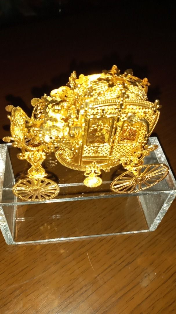 Ornate Gold Carriage Display Ornament (Category: Vintage Collectibles) located in Paranaque City. Submitted by zuprocsejon38604 (Listing ID 1462400409, Image 1). Description: - Beautifully detailed gold carriage ornament. - Features intricate scrollwork and design. - Adds a regal charm to shelves or tables. - Ideal for collectors or as a unique gift..