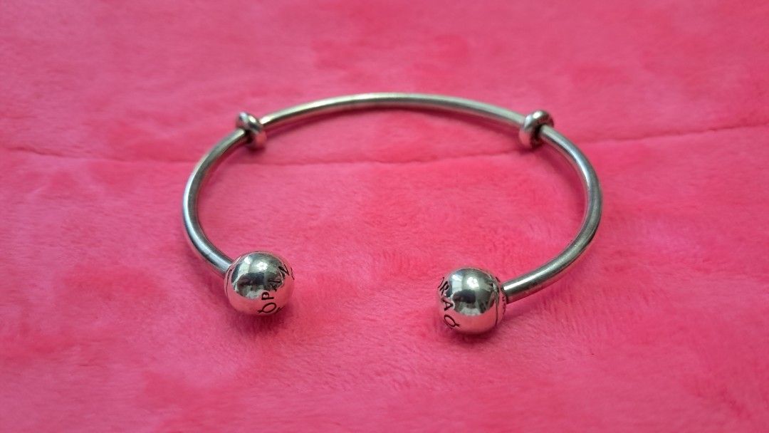Pandora Silver Open Bangle Bracelet (Category: Bracelets) located in Santa Rosa. Submitted by majanice (Listing ID 1462276139, Image 1). Description: - Authentic Silver Pandora Open Bangle Bracelet - bought from Pandora Makati - Features the iconic Pandora logo on the end balls - Ideal for showcasing your favorite Pandora charms - A classic and versatile piece for any jewelry collection size 19.