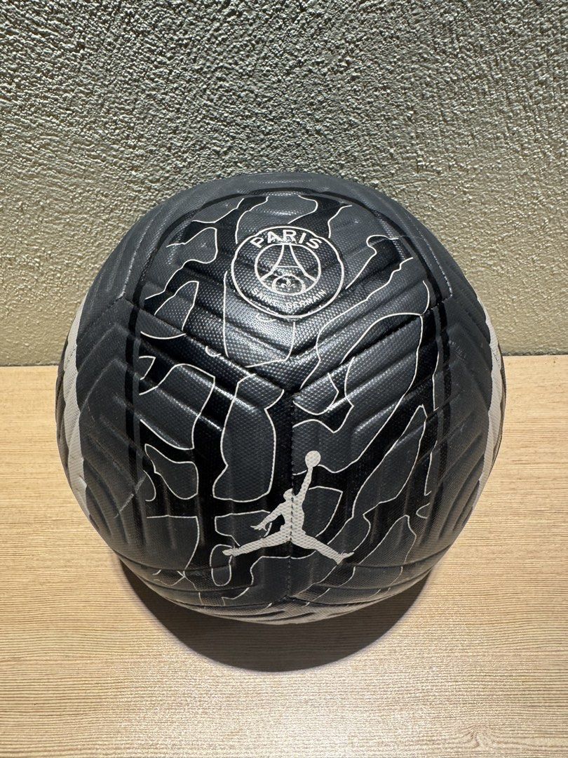 Paris Saint-Germain x Jordan Soccer Ball (Category: Racket and Ball Sports) located in Manila. Submitted by kuroshirooreo (Listing ID 1462274936, Image 2). Description: - Official Paris Saint-Germain x Jordan soccer ball - Features iconic PSG crest and Jordan Jumpman logo - Stylish dark grey color with white accents and graphics - Made in Vietnam - Ideal for collectors and passionate fans.