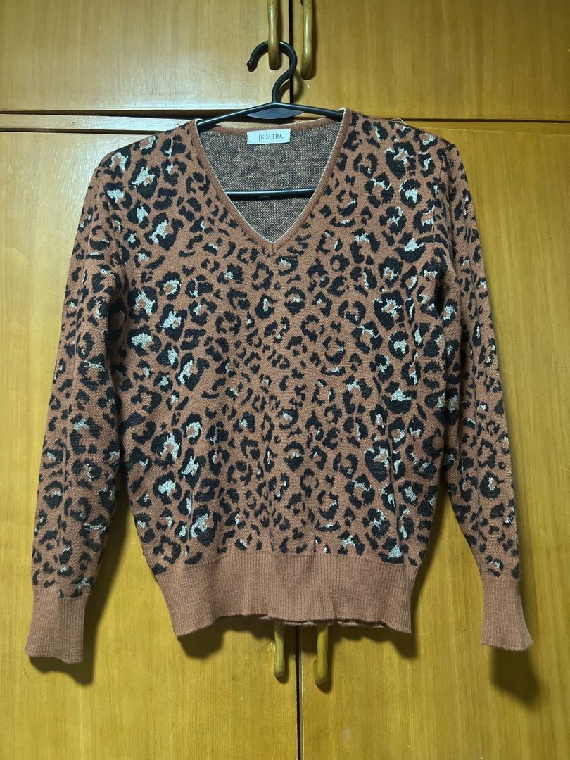 Pasoro Leopard Print V-Neck Knit Sweater (Category: Coats, Jackets and Outerwear) located in Pasig City. Submitted by zebteashoppe01 (Listing ID 1462410541, Image 1). Description: - Cozy brown knit sweater - Classic leopard print with black, white, and light blue accents - V-neckline - Ribbed cuffs and hem - Versatile for layering or wearing on its own - Stylish and comfortable Small .