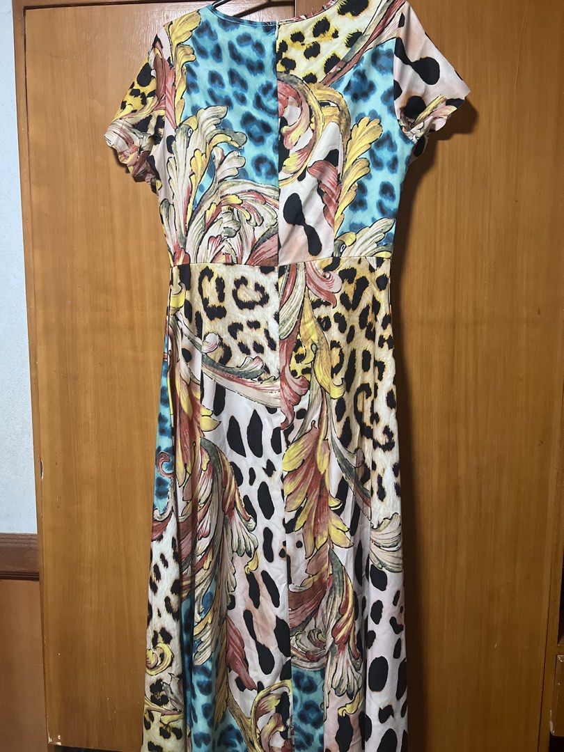 Patchwork Leopard Print Maxi Dress with Baroque Design (Category: Dresses) located in Pasig City. Submitted by zebteashoppe01 (Listing ID 1462408663, Image 3). Description: - Bold maxi dress with a unique patchwork print - Features a mix of leopard spots and baroque swirls - Short sleeves for a comfortable fit - Flattering silhouette that enhances your figure - Fabric has a subtle sheen for added elegance - Designed to make a statement and stand 