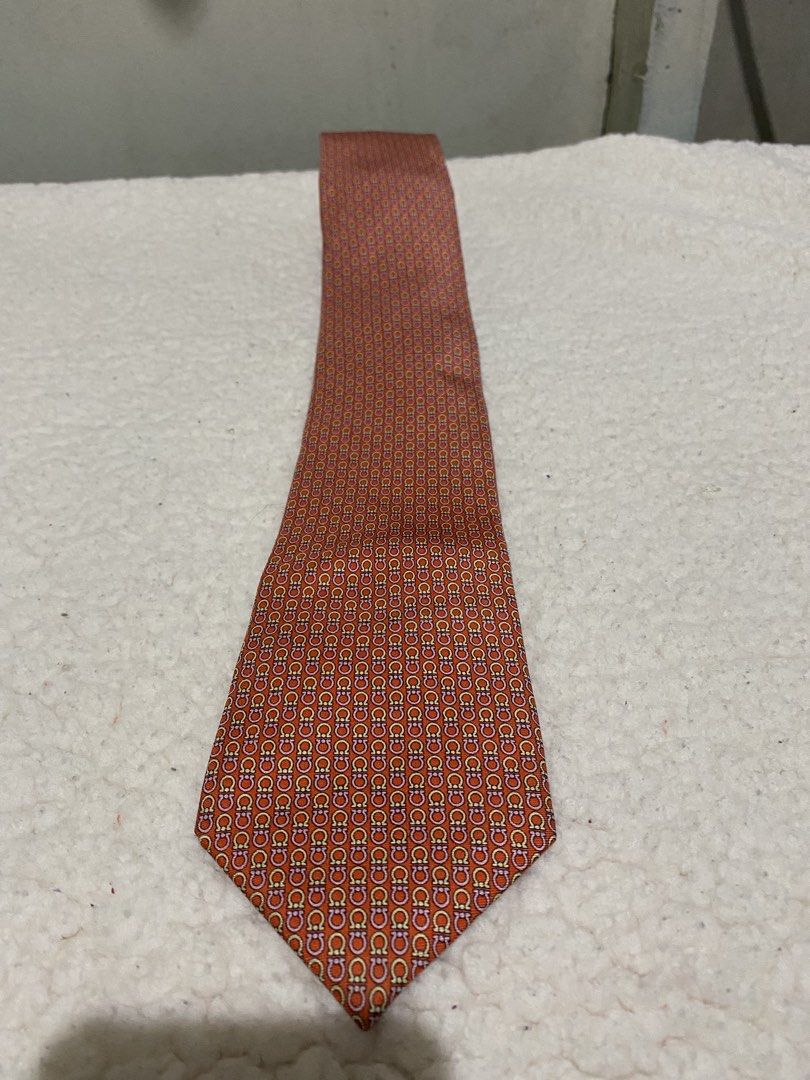 Perry Ellis Orange Patterned Silk Tie (Category: Ties) located in Manila. Submitted by resi.diaz (Listing ID 1462422830, Image 1). Description: - Brand: Perry Ellis - Color: Orange - Material: Silk - Style: Adds a touch of sophistication to any outfit.