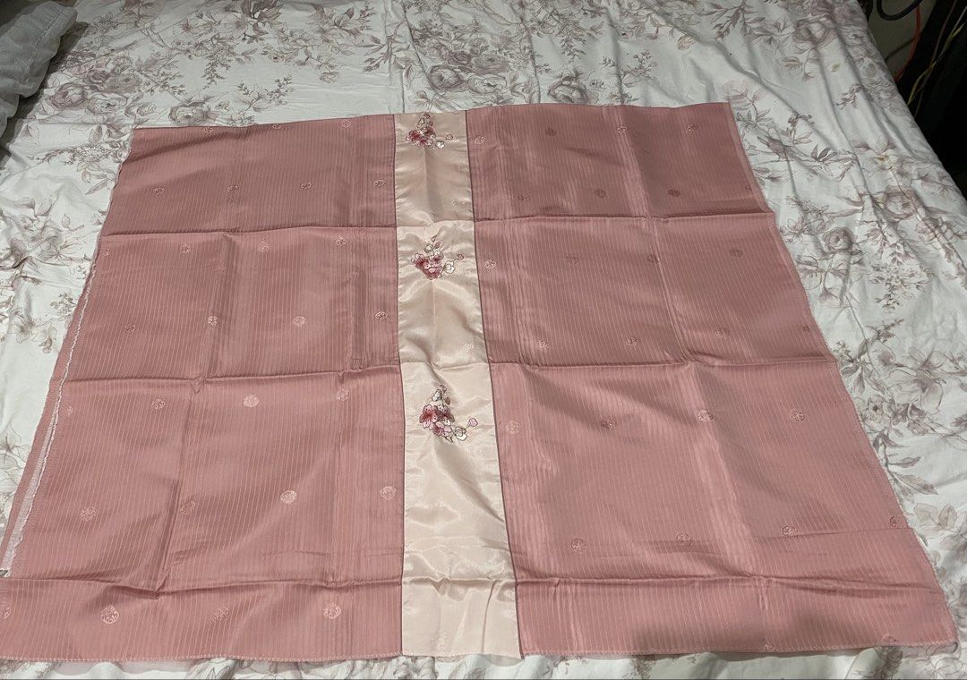 Pink Fabric with Floral Center Panel (Category: Other Home Decor) located in Manila. Submitted by resi.diaz (Listing ID 1462358809, Image 1). Description: - approx 41 x 71 inches - Pretty pink fabric - Central satin panel with embroidered flowers - Main fabric has subtle striped texture - Scattered small floral motifs on main fabric - Versatile for clothing or home decor - Neatly folded for storage.