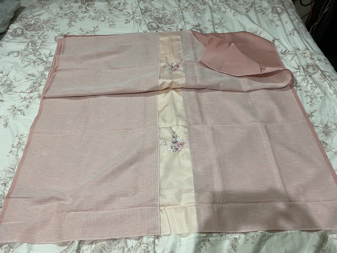Pink Fabric with Floral Center Panel (Category: Other Home Decor) located in Manila. Submitted by resi.diaz (Listing ID 1462358809, Image 3). Description: - approx 41 x 71 inches - Pretty pink fabric - Central satin panel with embroidered flowers - Main fabric has subtle striped texture - Scattered small floral motifs on main fabric - Versatile for clothing or home decor - Neatly folded for storage.