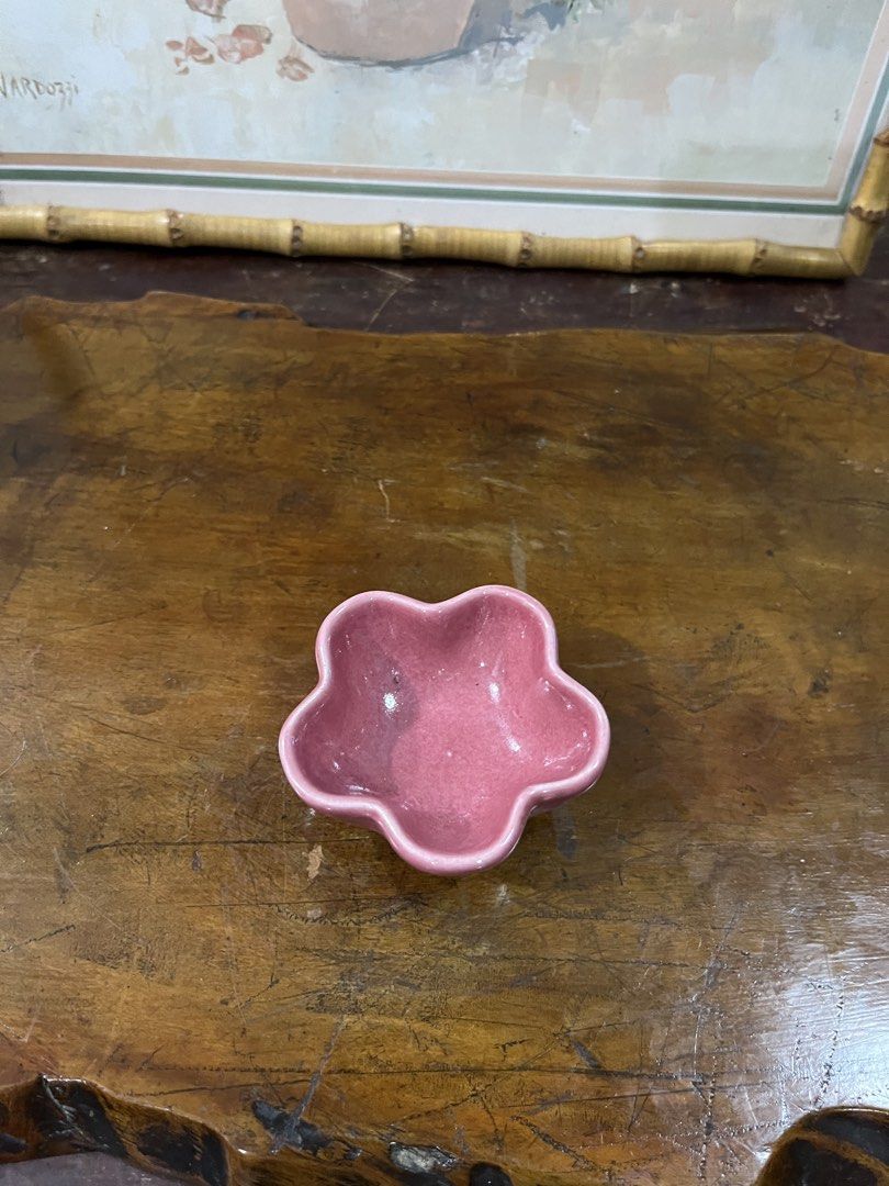 Pink flower-shaped ceramic trinket dish (Category: Dinnerware & Cutlery) located in Taguig. Submitted by minmin_parker (Listing ID 1462366856, Image 1). Description: - Adorable pink dish shaped like a flower. - Ideal for storing small jewelry, rings, earrings, or trinkets. - Features a beautiful glossy finish. - Perfect decorative piece for your vanity, dresser, or bedside table. - Compact size, fits easily anywhere..