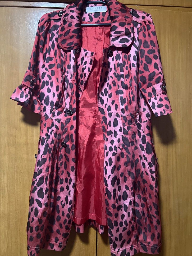 Pink Leopard Print Double-Breasted Trench Coat (Category: Coats, Jackets and Outerwear) located in Pasig City. Submitted by zebteashoppe01 (Listing ID 1462404279, Image 1). Description: - red leopard print trench coat - Double-breasted with button closure - Functional front pockets - Unique ruffled sleeve detail - Silky material for a luxurious feel - Perfect statement piece to elevate any outfit Suit like Fits small to med 09096535540 Gcash mop 