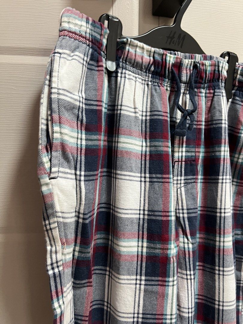 Plaid Pajama Pants with Drawstring Waist (Category: Babies & Kids Fashion) located in Cainta. Submitted by p3spreloved (Listing ID 1462303195, Image 2). Description: - Cozy plaid pajama pants - Elastic waistband with drawstring tie - Convenient side pockets - Cuffed ankles for a snug fit - Ideal for lounging or sleeping - Made with soft, relaxing fabric Length of pants 35in Waist 14in when laid flat but still stretchable upto 17in .