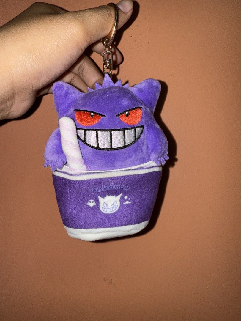 Pokemon Gengar Plush Keychain Lotteria (Category: Plushies & Soft Toys) located in Ozamiz City. Submitted by clickerx (Listing ID 1462368332, Image 1). Description: - Adorable Gengar plush keychain. - Features Gengar's iconic face. - Includes the Pokemon logo on the cup. - Comes with a durable metal keychain ring. Pm me here if you have any questions..