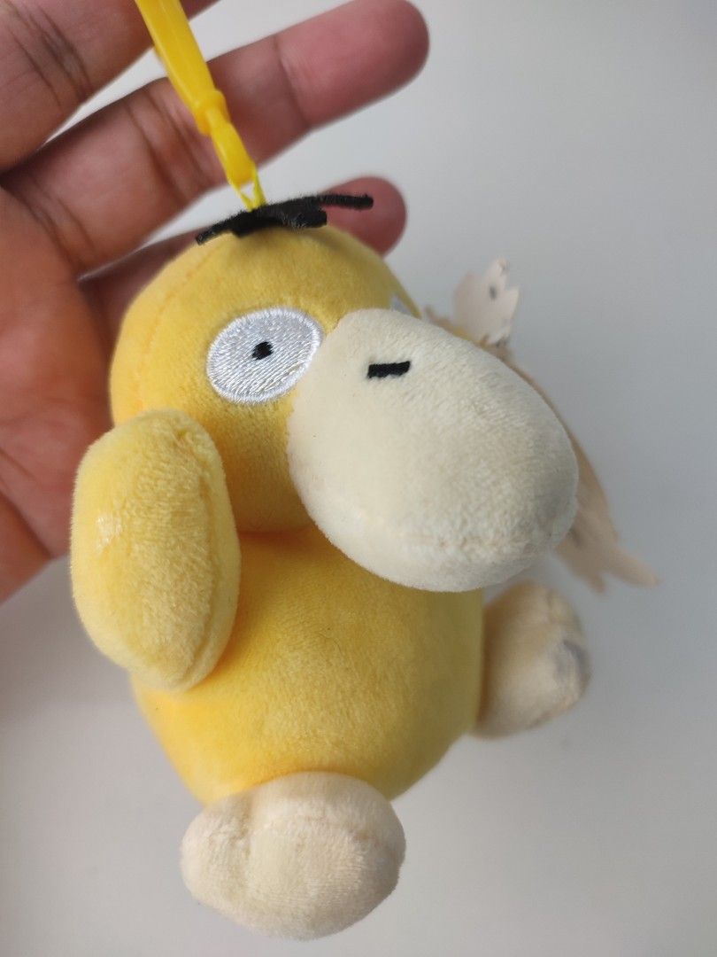 Pokemon Psyduck Plush Keychain (Category: Plushies & Soft Toys) located in Manila. Submitted by epicmountain-f20453 (Listing ID 1462360664, Image 2). Description: - Adorable yellow Psyduck plush toy - Includes a yellow clip for easy hanging - Brand new with original tag attached - Ideal for Pokemon enthusiasts and collectors - Small and portable, perfect for attaching to bags or keys.