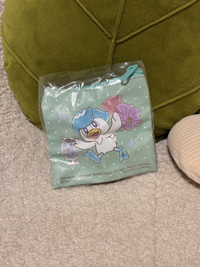 Pokemon Quaxly Coin Pouch Mint Green (Category: Other Stationery & Craft) located in Manila. Submitted by bernardine32364 (Listing ID 1462292287, Image 2). Description: - Pokemon Gashapon Pouch - Adorable mint green pouch featuring Quaxly - Secure zipper closure - Perfect for coins, cards, or small essentials - Fun and cute Pokemon-themed design - Comes in original packaging - Great gift for any Pokemon fan.
