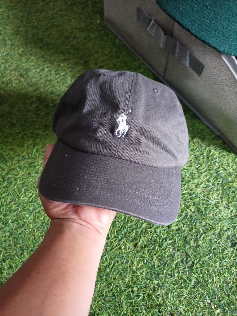 Polo Ralph Lauren Cap (Dark Gray) (Category: Caps & Hats) located in Abucay. Submitted by vcc.plug (Listing ID 1462374618, Image 1). Description: Still excellent - Washed - Adult size One size fits all Minimal loose stitch only (upper brim).