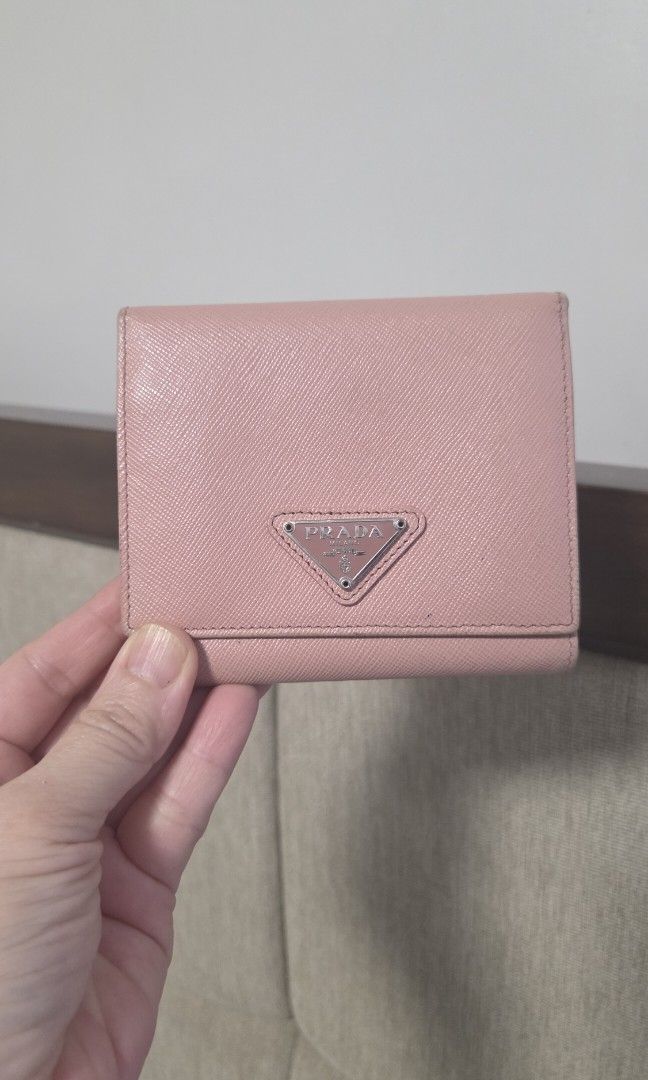 Pra mini wallet (Category: Luxury Bags & Wallets) located in Quezon City. Submitted by myprelovedfindsph (Listing ID 1462357079, Image 1). Description: Authentic Prada trifold wallet. With box and cards. Still in excellent condition..