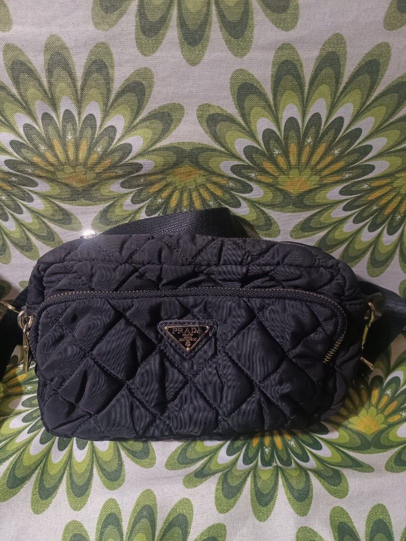 Bundled Prada Black Nylon Shoulder Bag with Chain (Category: Luxury Bags & Wallets) located in Cebu City. Submitted by elen30abalo (Listing ID 1462348658, Image 2). Description: - Prada bag - Black nylon material - Silver chain strap - Zipper closure - Small and compact, ideal for essentials - Versatile for night outs or casual wear - Shows minimal signs of wear.