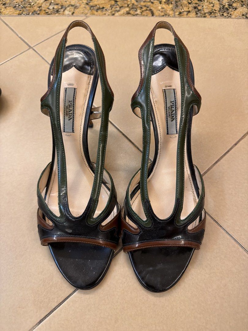 Prada Multi-Color Leather Slingback Heels (Category: Heels) located in Makati City. Submitted by sellebrity88 (Listing ID 1462349586, Image 1). Description: - Authentic Prada Spring 2012 flame leather sandals - Size 38.5 - Unique color block: black, green, and brown patent leather - Stylish slingback design with pointed toe - Moderate heel height - Made in Italy .