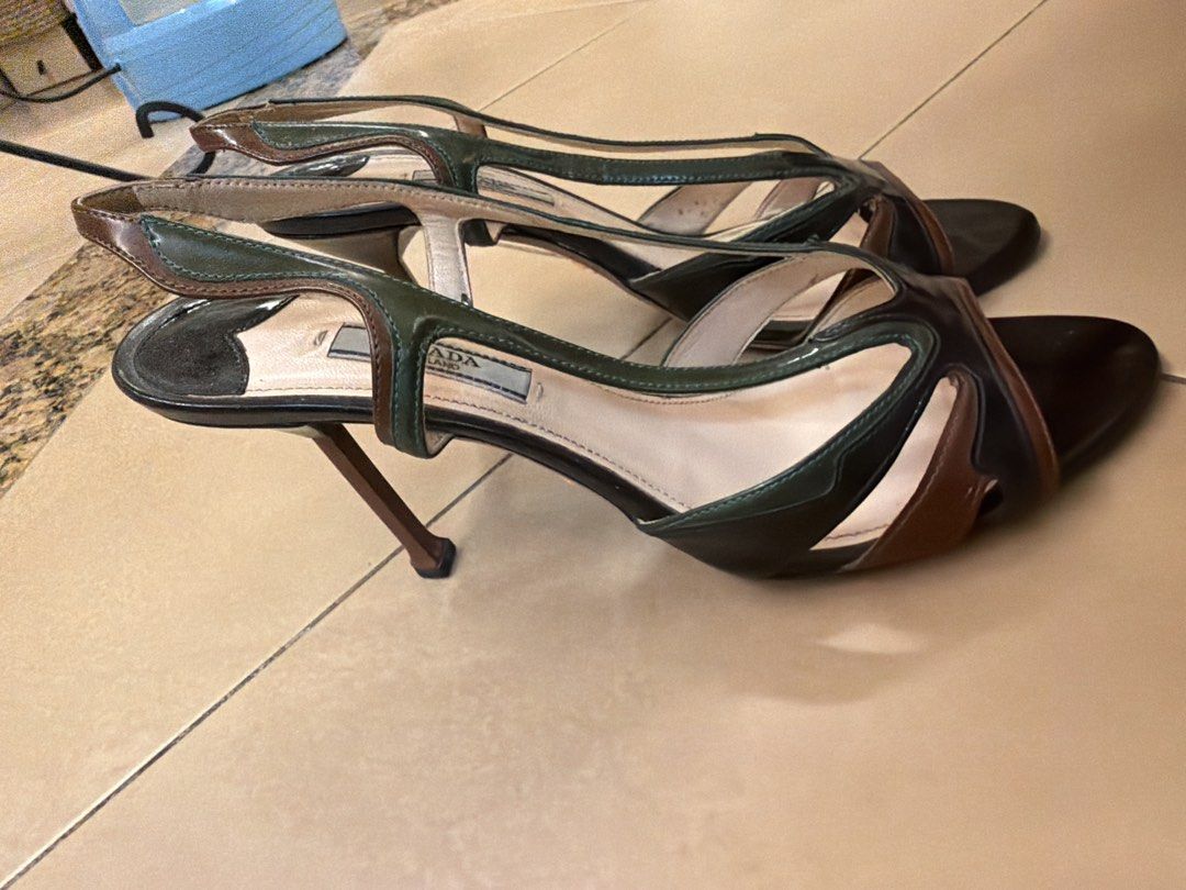 Prada Multi-Color Leather Slingback Heels (Category: Heels) located in Makati City. Submitted by sellebrity88 (Listing ID 1462349586, Image 2). Description: - Authentic Prada Spring 2012 flame leather sandals - Size 38.5 - Unique color block: black, green, and brown patent leather - Stylish slingback design with pointed toe - Moderate heel height - Made in Italy .