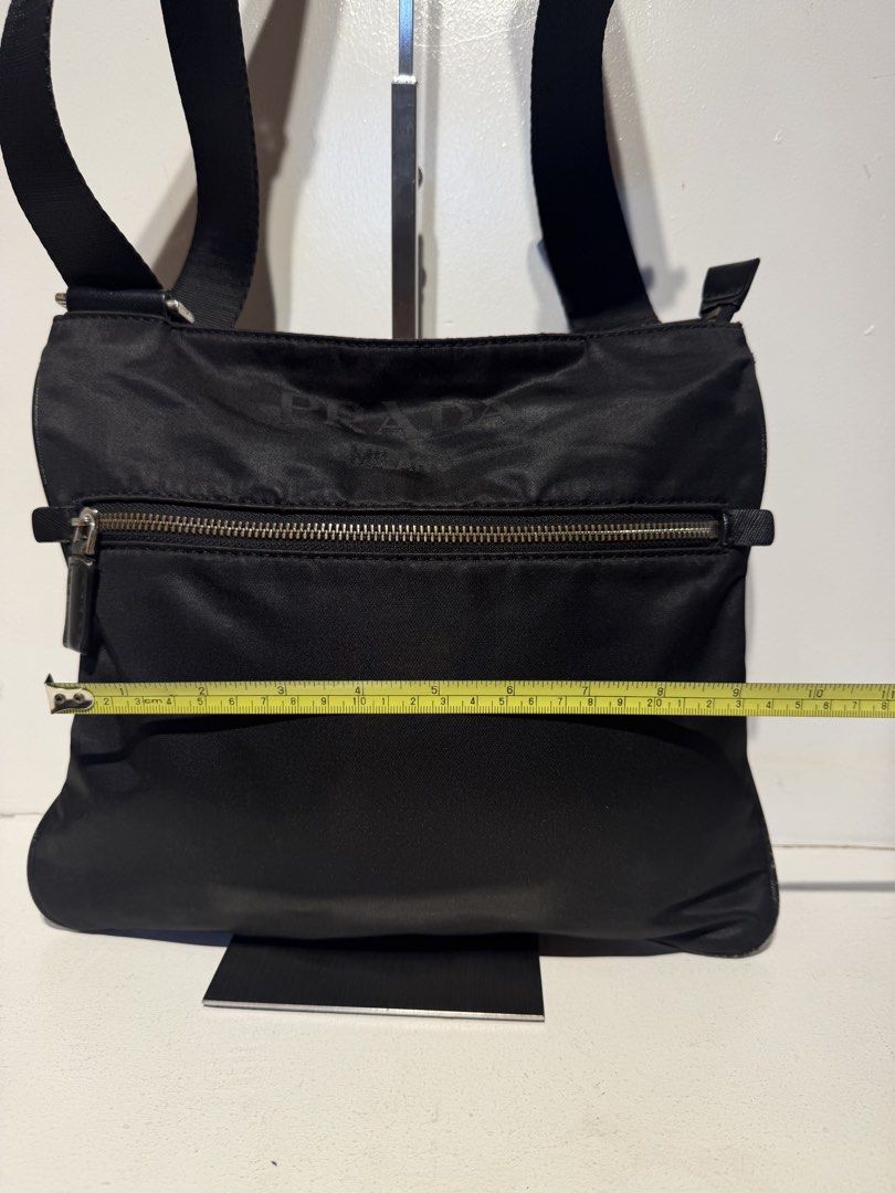 Prada Nylon Messenger Bag (Category: Luxury Bags & Wallets) located in Pasig City. Submitted by armoire_deluxe (Listing ID 1462420831, Image 3). Description: Pre💕 item. In good condition..