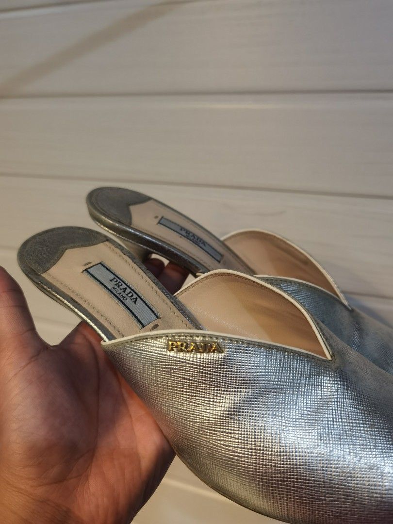 Prada Silver Metallic Leather Peep-Toe Mules Heels (Category: Heels) located in Tagaytay City. Submitted by SibsDeclutter4ever (Listing ID 1462404359, Image 3). Description: Authentic Silver metallic leather mules from Prada. Peep-toe design with a low heel. Easy slip-on style. The leather has a textured finish. Excellent used condition. Like new. Better in actual. LP. Selling low..