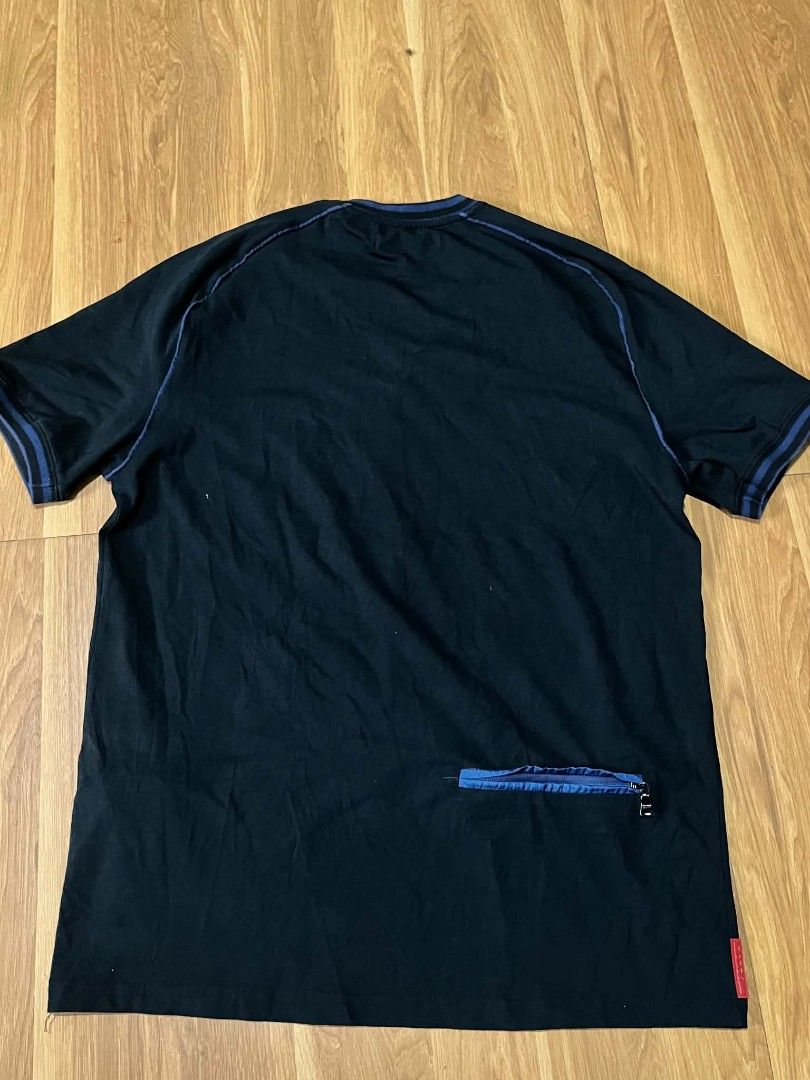 Prada Tshirt back zip pocket (Category: Luxury Apparel) located in Bulacan. Submitted by nifftyythrifty (Listing ID 1462434186, Image 2). Description: Prada Tshirt back zip pocket size medium.