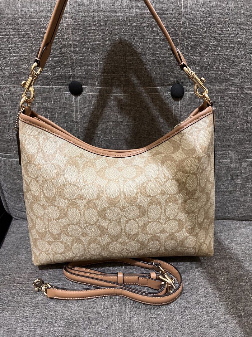 Preloved Coach Laurel from Hawaii (Category: Luxury Bags & Wallets) located in Manila. Submitted by zencat.93bfa9 (Listing ID 1462406671, Image 2). Description: - Classic Coach monogram shoulder bag - Tan and brown signature print - Light brown leather trim - Gold hardware details - Detachable crossbody strap included - Spacious interior - Ideal for everyday use.