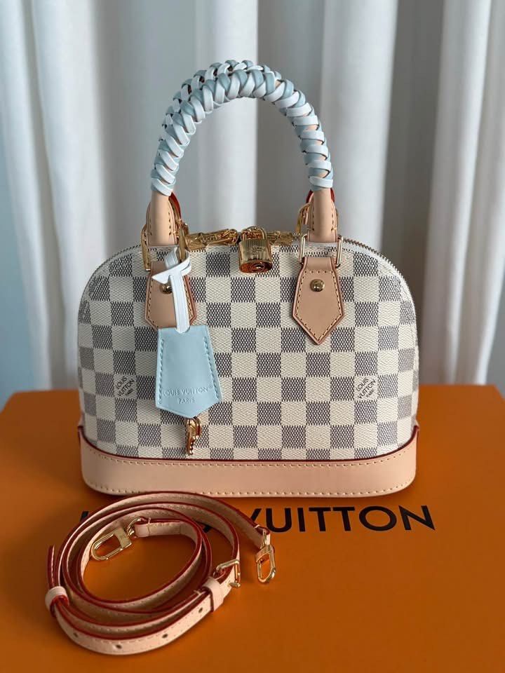 Preloved Lv Damier Azur Canvas (Category: Luxury Bags & Wallets) located in Manila. Submitted by bagsandmanymanymore1 (Listing ID 1462381812, Image 1). Description: Preloved Damier Azur Signature Size 23.5cm(L) x 17.5cm(H) x 11.5cm(W) Coated canvas Damier Azur/Blue Olympe Cowhide leather trim Textile lining Gold toned hardware Double zipper closure 1 inside flat pocket 1 removable address tag Fits smartphone, earphones, keys, sunglasses Strap:Rem