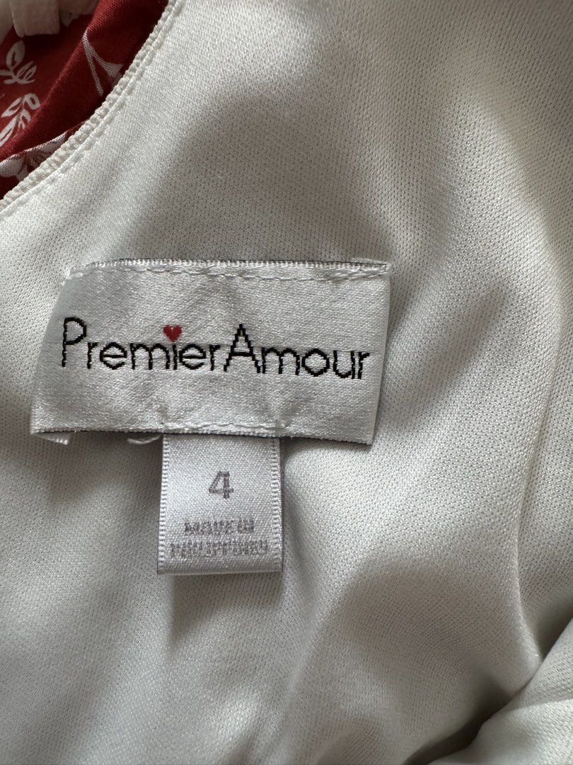 Premier Amour White Cold Shoulder Romper Size 4 (Category: Rompers) located in Manila. Submitted by prelovedshopmnl (Listing ID 1462307488, Image 3). Description: - White cold shoulder romper by Premier Amour - Flattering V-neckline with wrap-style front - Comfortable elasticated waist - Stylish tie detail at the back with zipper closure - Size 4.