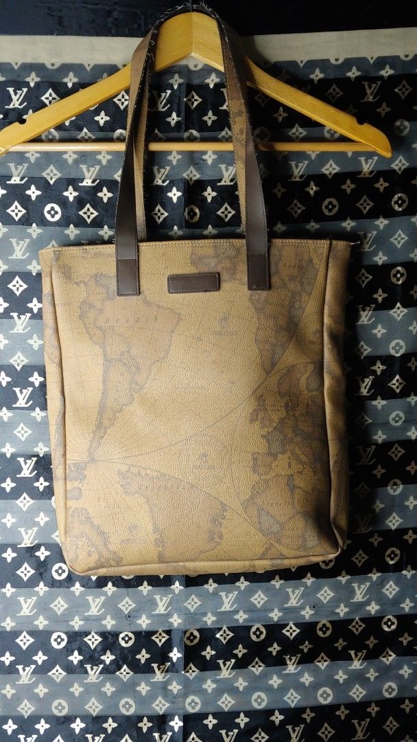 Prima Classe Geo Map Tote Bag (Category: Tote Bags) located in Kitaotao. Submitted by wilddolphin.0a0db3 (Listing ID 1462394197, Image 1). Description: - Iconic Prima Classe Geo Map print - Classic brown and tan colorway - Genuine leather handles and trim - Spacious main compartment - Interior zip pocket for essentials - Ideal for everyday use or travel.