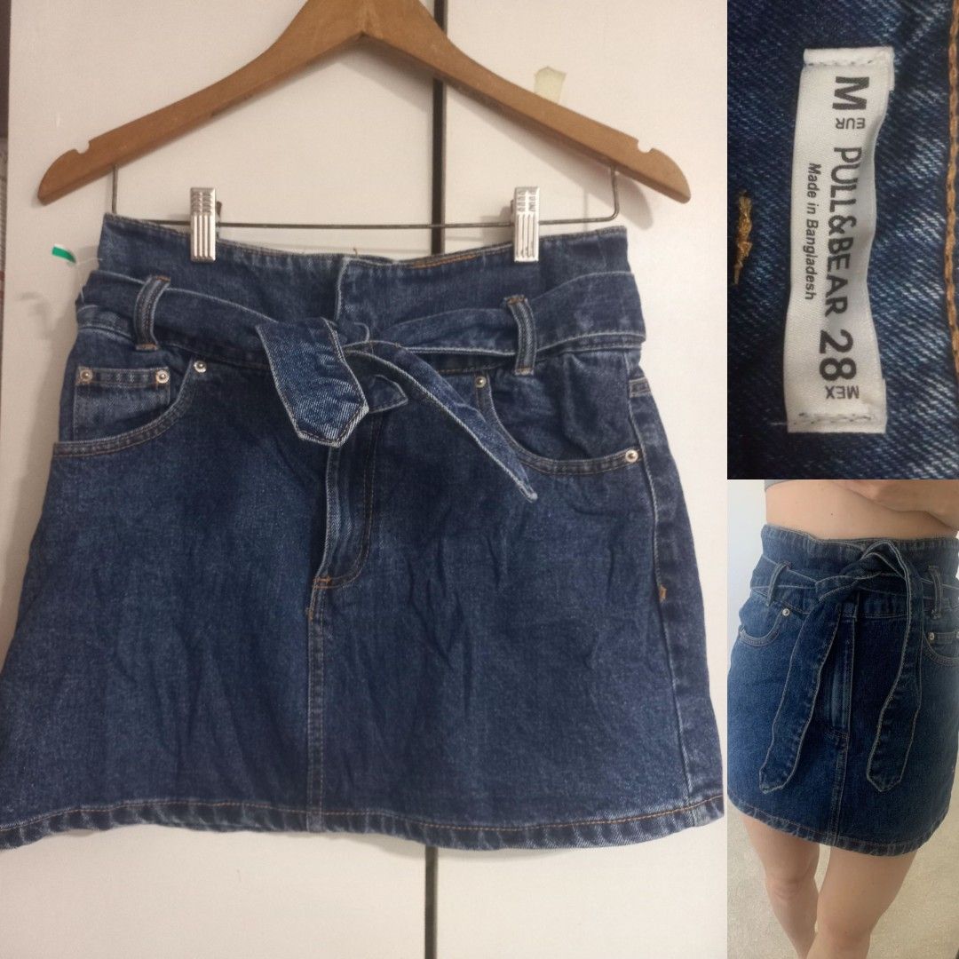 Pull & Bear Denim Skirt with Belt Size 28 (Category: Skirts) located in Manila. Submitted by maryjoyenc89891 (Listing ID 1462317724, Image 1). Description: - Pull & Bear blue denim skirt - Size 28 - Features a tie belt at the waist - Classic five-pocket styling - Made in Bangladesh - Ideal for casual wear.