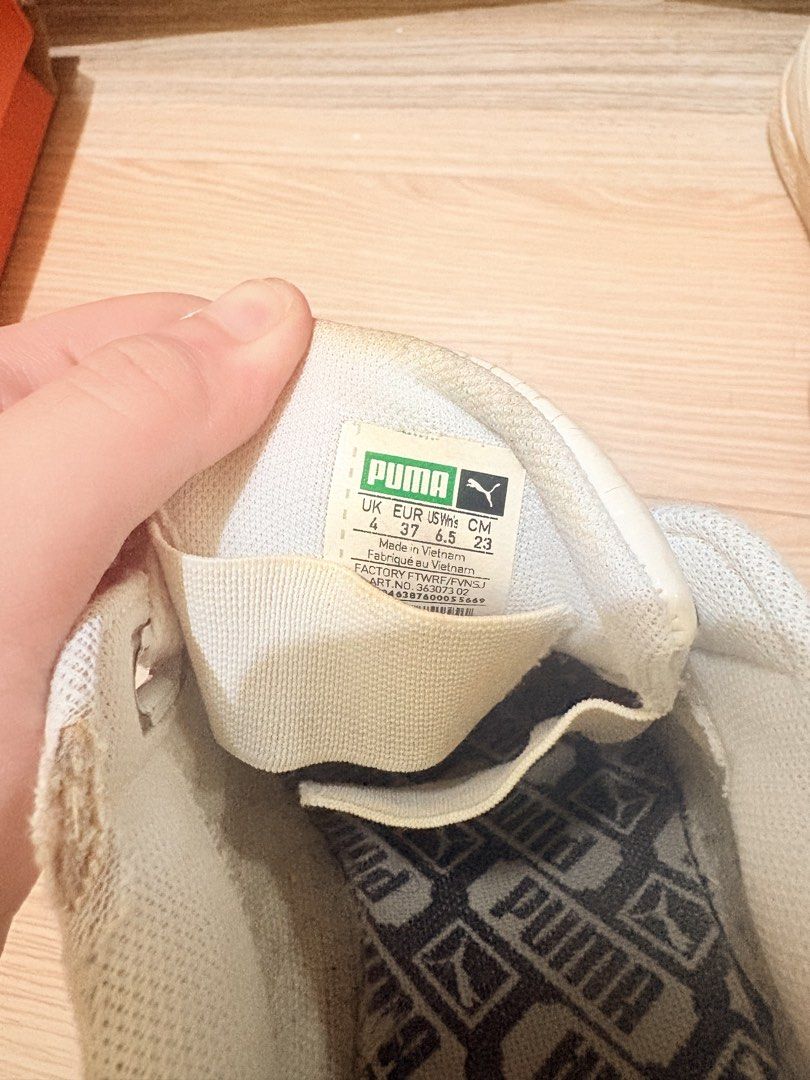 Puma Basket White Leather Sneakers (Category: Sneakers) located in Manila. Submitted by wildforest_de8e6f (Listing ID 1462373843, Image 3). Description: - White Puma Basket sneakers - Genuine leather material - Size 37 EU - Minor creasing on toe box - Slight scuffing on sole - Thick white laces - Made in Vietnam.