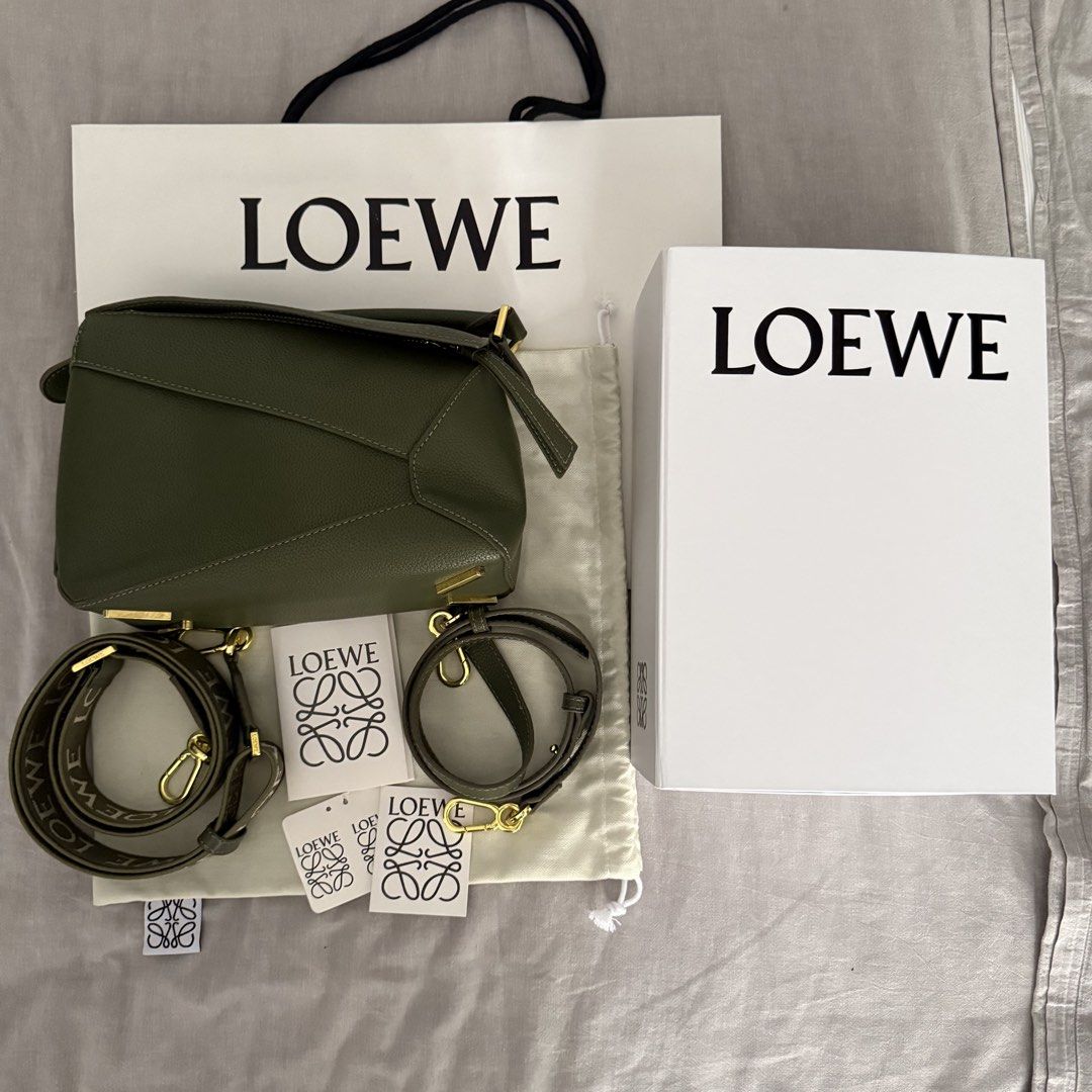 Loewe Puzzle Bag (Category: Luxury Bags & Wallets) located in Makati City. Submitted by imjustagirlxo (Listing ID 1462278406, Image 1). Description: Small Loewe Puzzle Bag in Olive Green Includes Dust bag, original box, shopping bag, and crossbody straps Bought from HK.