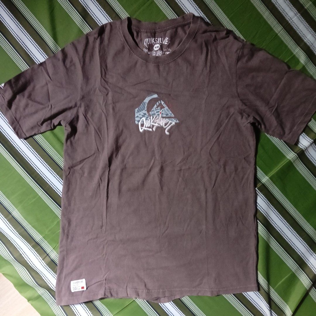 Quiksilver Mountain & Wave T-shirt (Category: Tshirts & Polo Shirts ) located in Manila. Submitted by silentstone.4b0628 (Listing ID 1462396900, Image 1). Description: - Brown Quiksilver T-shirt - Features the classic Quiksilver Mountain & Wave graphic on both front and back - Designed for boardriding activities - Also great for everyday casual wear.