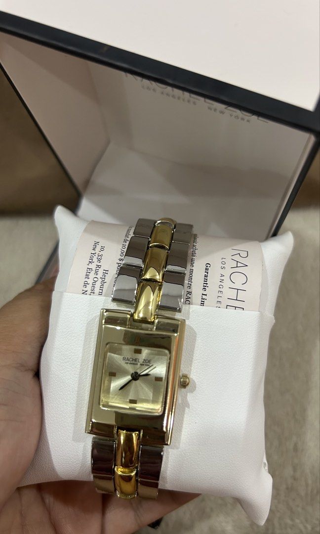 Rachel Zoe Two-Tone Square Face Watch (Category: Women's Watches) located in Quezon City. Submitted by brlt0349 (Listing ID 1462364017, Image 1). Description: - Gold and silver tone watch - Square face with a clean dial - Bracelet band with mixed metal links - Includes original box - Versatile accessory for any outfit.
