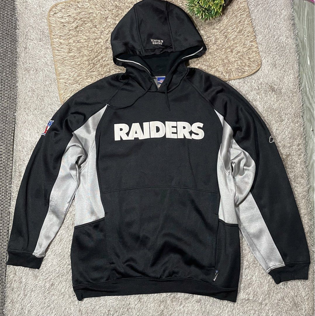raiders silver black hoodie by reebok (Category: Hoodies) located in Las Pinas. Submitted by moncaz2461827 (Listing ID 1462379069, Image 1). Description: Raiders NFL by reebok (black silver) Large on tag Dimes 25.5x31 Excellent condition Color rate 9.9/10 No issue Need wash 💌.