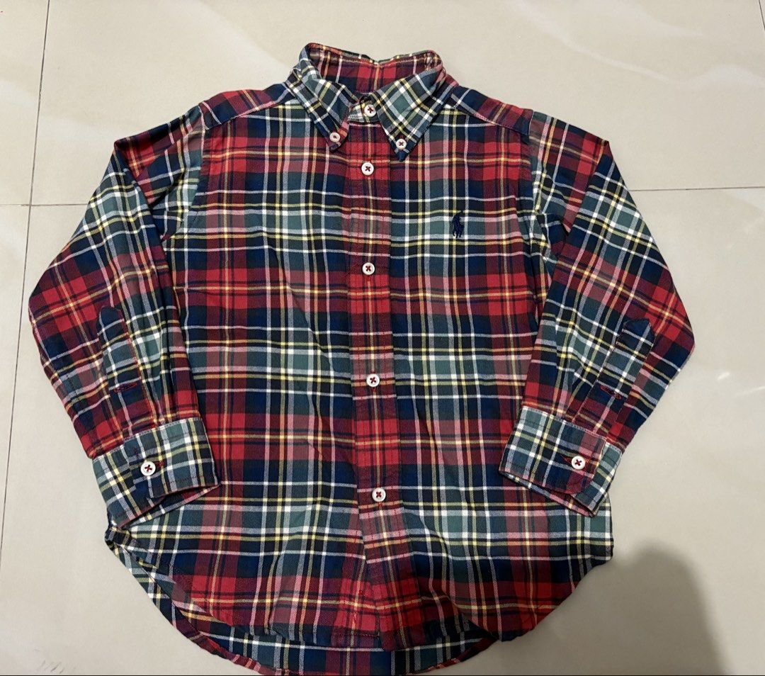 Ralph Lauren Plaid Button Down Shirt (Category: Babies & Kids Fashion) located in Quezon City. Submitted by polly.kids (Listing ID 1462391299, Image 1). Description: - Classic Ralph Lauren plaid shirt - Long sleeves with button cuffs - Button-down collar - Made in Indonesia - 100% cotton - Great for casual wear.