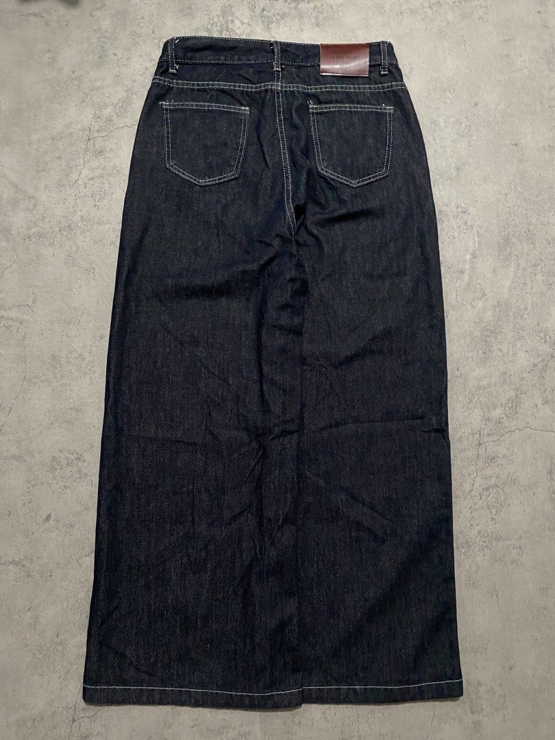 raw denim pants (Category: Jeans) located in Batangas. Submitted by yuellll (Listing ID 1462375688, Image 2). Description: Width:32 Length:42 Thigh:14.5 Hem:13.3 Color rate:10/10 Condition:10/10 Issue: N/A - Dark wash denim maxi skirt - Full length with a wide leg opening - Classic five-pocket styling - Button and zip closure at the front - Brown leather patch at the back waistband - White contrast stitching throughout - Perfect staple piece for 