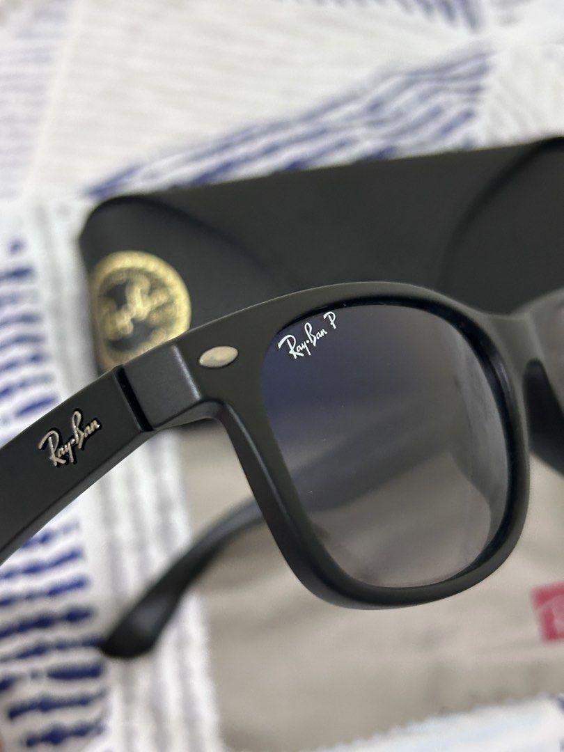 Ray-Ban New Wayfarer Polarized (Category: Sunglasses & Eyewear) located in Mandaluyong City. Submitted by nicko.montalbo (Listing ID 1462369125, Image 2). Description: - Authentic Ray-Ban New Wayfarer Sunglasses - Model: RB2132F - Polarized lenses for reduced glare - Made in Italy - Classic black frame with dark lenses - Includes original Ray-Ban case and cleaning cloth - Ideal for everyday wear - Price: Php 7,500 negotiable Meet ups: Mrt Boni, M