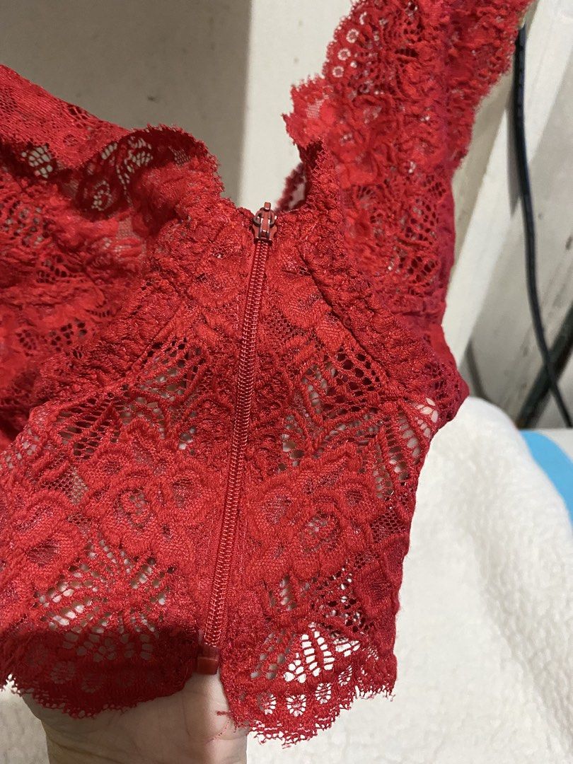 Red Lace Bralette with Zipper Front (Category: Undergarments & Loungewear) located in Manila. Submitted by resi.diaz (Listing ID 1462346358, Image 2). Description: Red lace bralette. Has a zipper in the front. Scalloped lace trim along the edges. Comfortable and stylish. Great for layering or wearing on its own. Shows off a bit of skin with the lace detail. Good for casual wear or a night out..