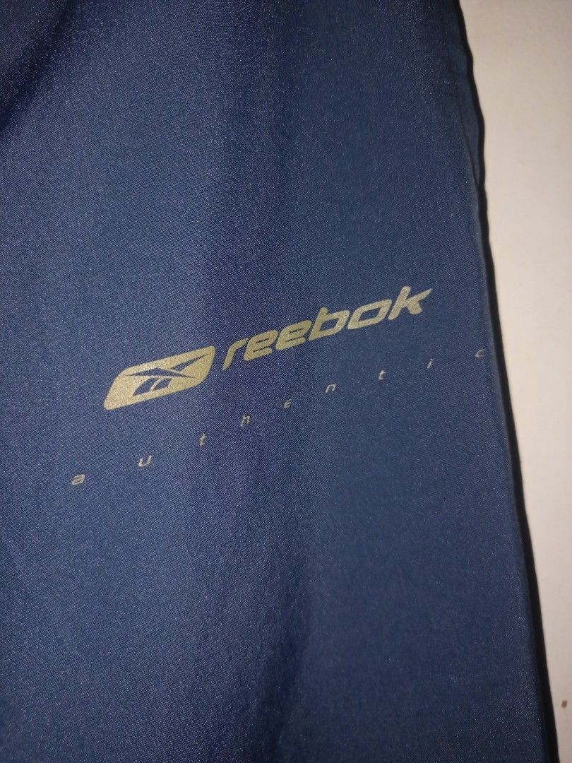 Reebok track pants with ankle zip (Category: Joggers) located in Manila. Submitted by kenny200024 (Listing ID 1462293571, Image 3). Description: Reebok track pants with ankle zip - size medium - actual measurement waistline 32-38 width 16 | length 41 | leg opening 8-9 - very good condition - honest issue missing lace, nilagyan lang po sya ng garter para mag silbing lace kaya sya kulubot sa pic.