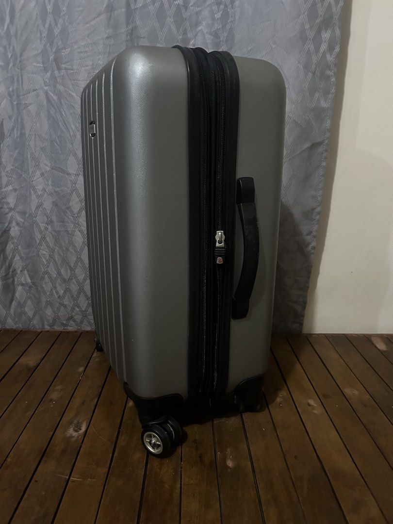 Ricardo Beverly Hills Silver Hardside Spinner Luggage (Category: Luggage) located in Taguig. Submitted by ghiebow06 (Listing ID 1462376612, Image 2). Description: Dimensions: H- 21 1/2 W- 15 D- 8 1/2 (1.5in extra depth) - Silver Ricardo Beverly Hills expandable hardside spinner luggage - Four spinner wheels for effortless gliding - Retractable handle for easy pulling - Convenient side handle for carrying - Secure zipper closure - Shows minor scuf