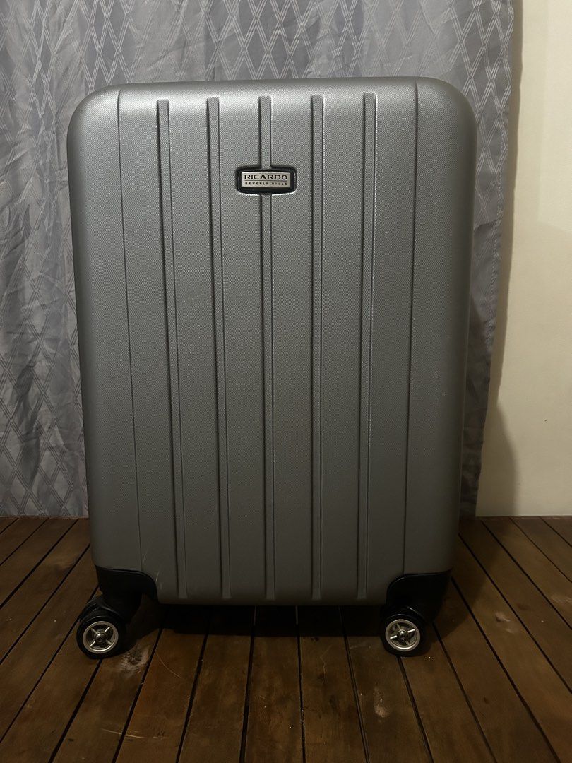 Ricardo Beverly Hills Silver Hardside Spinner Luggage (Category: Luggage) located in Taguig. Submitted by ghiebow06 (Listing ID 1462376612, Image 1). Description: Dimensions: H- 21 1/2 W- 15 D- 8 1/2 (1.5in extra depth) - Silver Ricardo Beverly Hills expandable hardside spinner luggage - Four spinner wheels for effortless gliding - Retractable handle for easy pulling - Convenient side handle for carrying - Secure zipper closure - Shows minor scuf