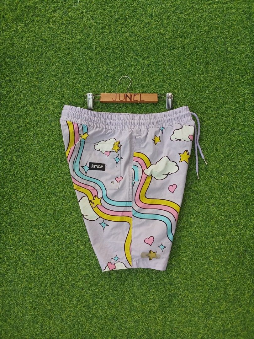 Ripndip Purple Cat Rainbow Shorts Size M (Category: Shorts) located in Cebu City. Submitted by junelsugar (Listing ID 1462379703, Image 2). Description: - Cute Ripndip shorts - Purple base color - All-over print: cat, clouds, stars, rainbows - Elastic waistband with drawstring - Size: Medium (M) - Ideal for casual wear or lounging.