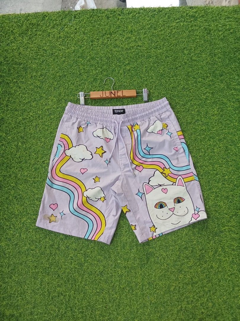 Ripndip Purple Cat Rainbow Shorts Size M (Category: Shorts) located in Cebu City. Submitted by junelsugar (Listing ID 1462379703, Image 1). Description: - Cute Ripndip shorts - Purple base color - All-over print: cat, clouds, stars, rainbows - Elastic waistband with drawstring - Size: Medium (M) - Ideal for casual wear or lounging.