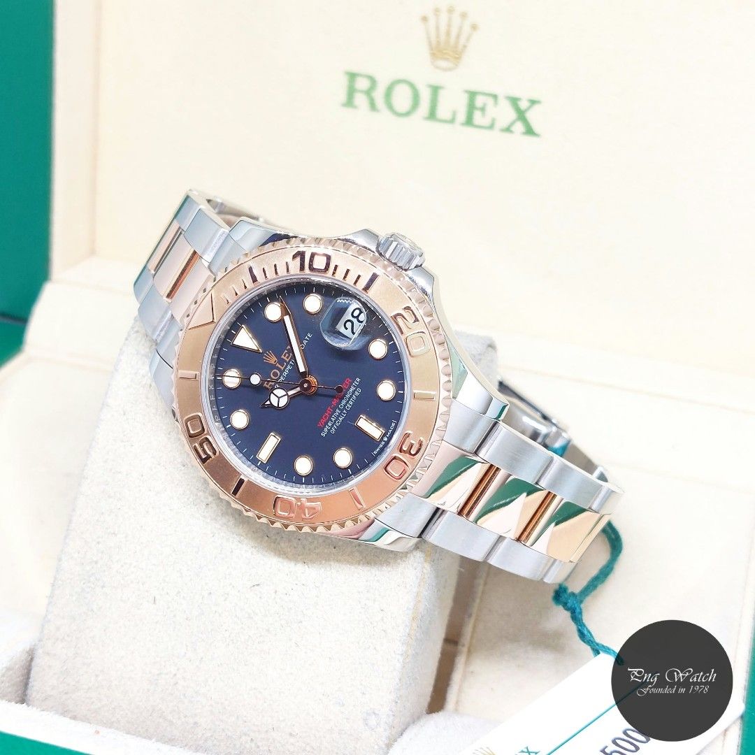 Rolex 37mm 18K Half RG Black Dial Yachtmaster Date REF: 268621 (Box, Cert & Serial Tag-2021) (Category: Watches) located in Singapore. Submitted by pngwatchdealer (Listing ID 1462431485, Image 1). Description: [SPECIFICATIONS] **Watch comes in full option (Box, Card & Matching serial tag)** **Straight bracelet** **Full Links** Brand: Rolex Model: Oyster Perpetual Black Dial 37mm Yachtmaster Date (REF: 268621)(AN)(21) Movement: Automatic (Self-Win