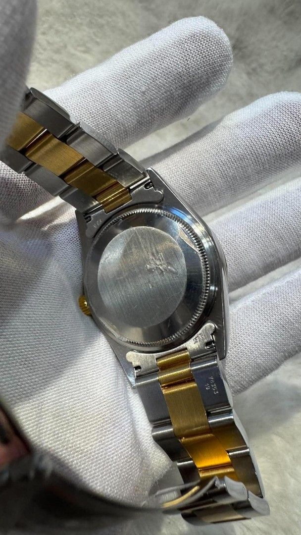 Rolex Oyster Perpetual Two-Tone Watch (Category: Luxury Watches) located in Mandaluyong City. Submitted by jayden20cl28541 (Listing ID 1462358699, Image 3). Description: - Rolex Oyster Perpetual Watch - Two-tone: Stainless Steel and Gold - Dial: Grey with Arabic Numerals - Movement: Automatic - Style: Classic, versatile for daily wear or special events.