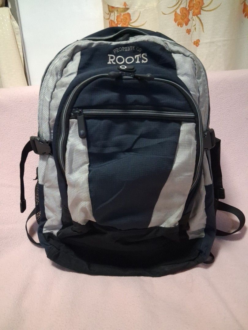Roots Backpack Navy Blue Grey (Category: Backpacks) located in Angeles City. Submitted by anneps (Listing ID 1462406452, Image 1). Description: - Roots backpack in navy blue and grey. - Multiple zippered compartments for easy organization. - Padded shoulder straps ensure comfortable carrying. - Side mesh pockets are perfect for water bottles. - Durable material built to last. - Zippers are in good working condition. - Ideal for school, work, or d