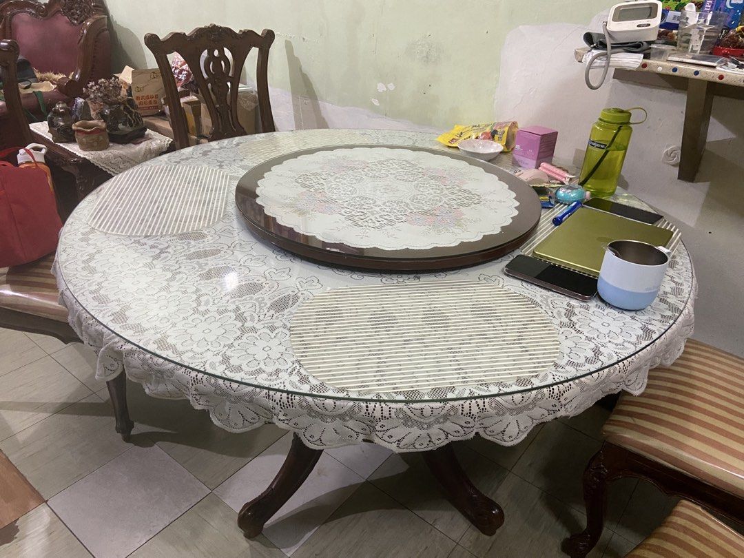 Round Dining Table with 5 Chairs (Category: Tables & Sets) located in Manila. Submitted by hh.king (Listing ID 1462434422, Image 1). Description: Round wood dining table set with lazy susan and wooden base Includes the ff: - 6 matching wooden chairs with striped upholstered plastic covered seats - Glass toppers - white lace design table cloth Measurements: 54 inches diameter of table 31 inches height of table 28 inches diameter of lazy susan PM f