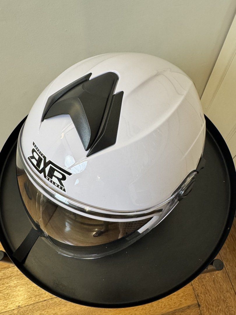 RXR Titanium Motorcycle Helmet with Anti-Scratch Visor (Category: Helmets and other Riding Gears) located in Manila. Submitted by supremeloved (Listing ID 1460954172, Image 2). Description: -original price: 729 -selling price: 400 - Glossy White RXR helmet (half face) -Used for taking videos lang - Titanium design on the back - Anti-scratch visor - Clean and well-padded interior - Quick-release buckle strap - Ready for your next ride!.